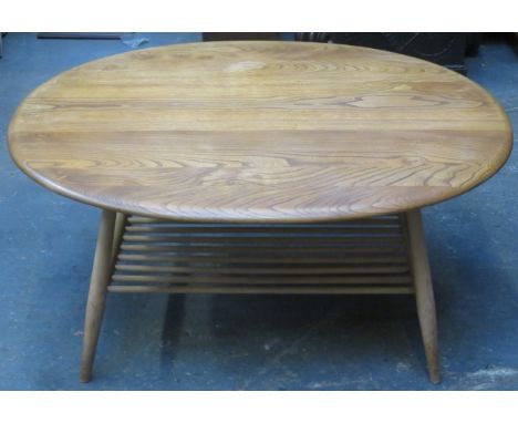 Ercol mid 20th century light oak oval coffee table. Approx. 44cm H x 99cm W x 82.5cm D 