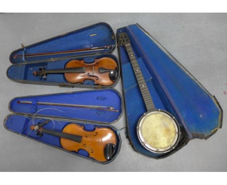 Vintage banjo and two violins, all with hard cases (3) 