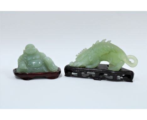 Carved jade dragon and a jade Buddha, both with wooden bases (2) 17cm 