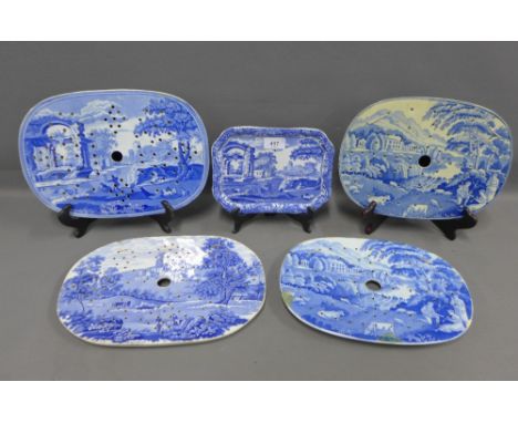 Four various 19th century Staffordshire blue and white mazarine drainers, largest 33cm, and a later Spode drainer (5) 