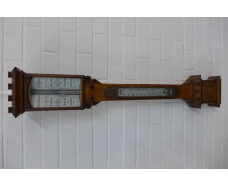 Victorian oak barometer in an architectural style case, dial inscribed P.J Butler, London. 106 x 18cm 