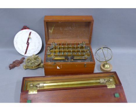 Brass navigation ruler in a fitted mahogany box, reproduction brass compass, astral chart, small brass globe and Gambrell Bro