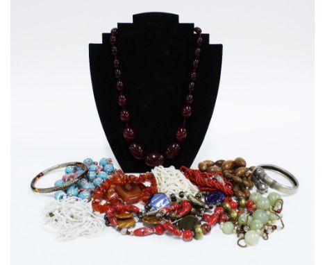 Vintage coral beads, strand of faux cherry amber beads, jadeite beads, coloured glass beads and agate beads, etc, together wi