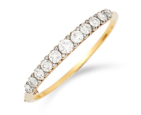ANTIQUE DIAMOND BANGLE, CIRCA 1900 set with approximately 10.0 carats of diamonds graduated old round cut diamonds, inner dia