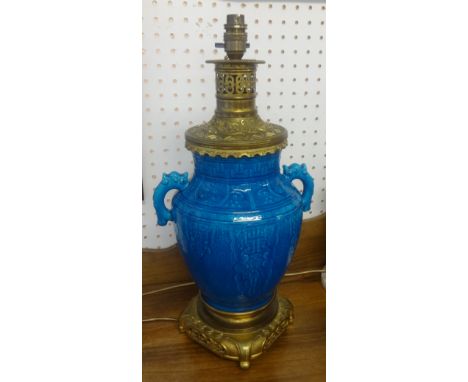 A 20th century Chinese pottery an gilt brass table lamp, height 46cm.