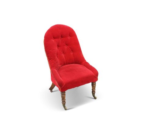 A VICTORIAN WALNUT AND UPHOLSTERED NURSING CHAIR with button-back, on turned fore legs, moving on castors. Height of back 86.
