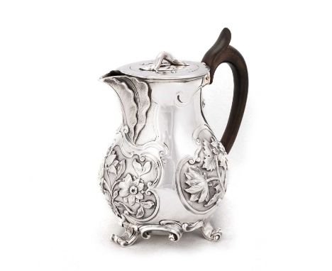 A GEORGE IV SILVER HOT WATER JUG by Paul Storr, London 1829, naturalistically chased with bold floral reserves, acanthus leav