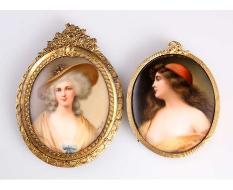 TWO PAINTED PORCELAIN OVAL PORTRAIT PLAQUES, LATE 19TH CENTURY each painted by Wagner with a lady, signed, in gilt-metal fram