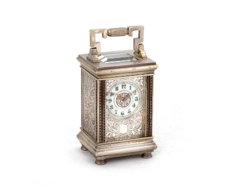 A LATE 19TH CENTURY SILVERED BRASS CARRIAGE CLOCK the backplate signed Breguet and numbered 4975, of small proportions, the s