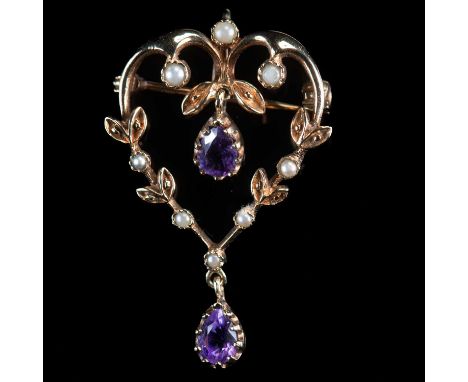 AN EDWARDIAN STYLE 9 CARAT YELLOW GOLD AMETHYST AND SEED PEARL HEART SHAPED BROOCH/ PENDANT  London 1990, the heart shaped op