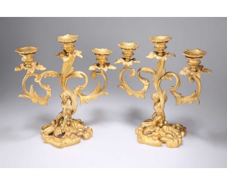 A PAIR OF LOUIS XV STYLE ORMOLU THREE-LIGHT CANDELABRA, 19TH CENTURY each with leaf-cast branches supported by the figure of 