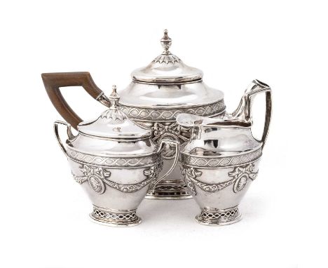 A DUTCH SILVER THREE-PIECE TEA SERVICE, CIRCA 1900 comprising a teapot, cream jug and covered two-handled sugar bowl, each ap