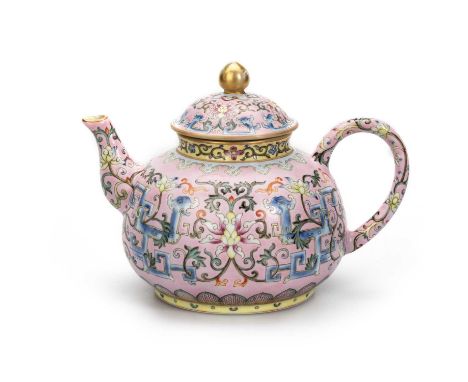 A CHINESE FAMILLE ROSE TEAPOT decorated on each side with a large lotus blossom borne on scrolls, bears iron seal mark. 12.5c