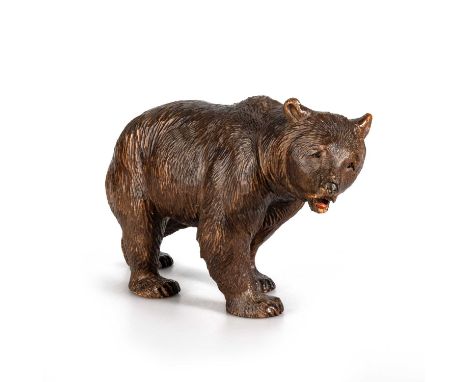 A BLACK FOREST CARVED BEAR, LATE 19TH/ EARLY 20TH CENTURY modelled standing with an mouth open and inset eyes. 16.5cm high, 2