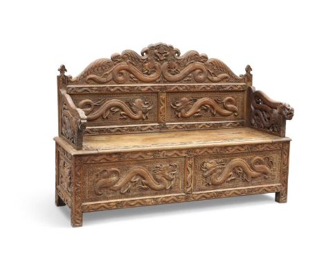 A 19TH CENTURY CHINESE CARVED HARDWOOD BENCH the two-panel back carved with dragons, the pierced arms carved with dragons, th