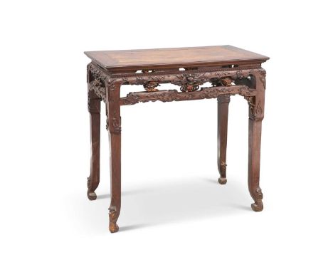 A 19TH CENTURY CHINESE HARDWOOD CENTRE TABLE the rectangular top with a floating panel above a pierced and carved frieze, rai