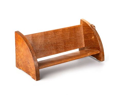 ROBERT THOMPSON OF KILBURN, A MOUSEMAN OAK BOOK TROUGH, CIRCA 1970 of typical form, with carved mouse signature. 20.3cm high,