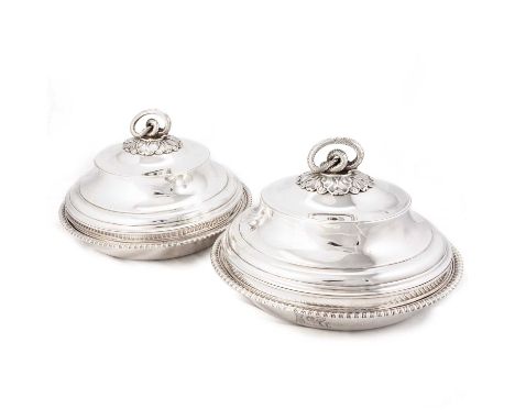 A PAIR OF GEORGE III SILVER ENTRÉE DISHES AND COVERS by Paul Storr, London 1807, each of circular form with a gadrooned rim a