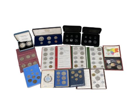 Fourteen (14) world proof and uncirculated sets. Includes (1) 1967 Brazil Cruzeiro Novo seven-coin set in blue wallet, (2) 19