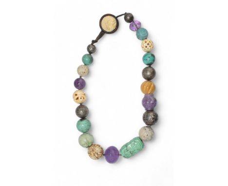 Chinese and Japanese Circa 1900 A very unusual carved jade, amethyst, turquoise, silver and bone pendant bead necklace compos