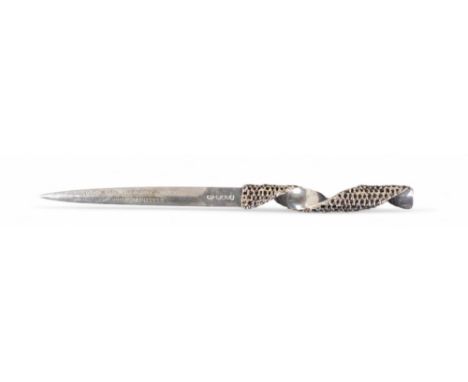 20th Century A silver letter opener with a pierced twisted handle, hallmarked Stuart Devlin, London, 1977. The blade inscribe