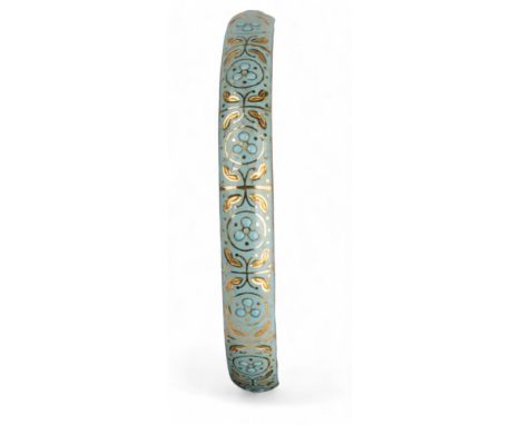 British, Circa 1910 A yellow gold and duck egg blue enamel bangle. The bangle finely decorated with flower head clusters and 