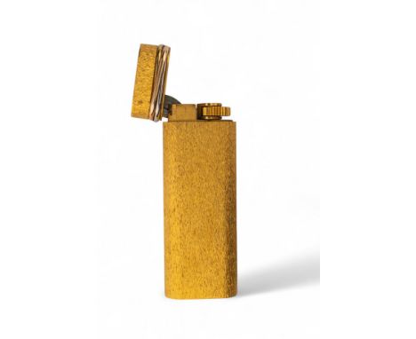 Cartier Paris Circa 1980 A bark finish plaque d'or lighter With a three coloured gold twist band With original Cartier leathe