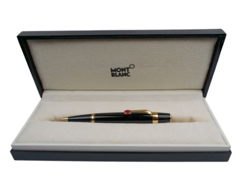 Montblanc Swiss Circa 2000 A black lacquer and gilt ballpoint pen With a synthetic ruby clip With the original box and litera