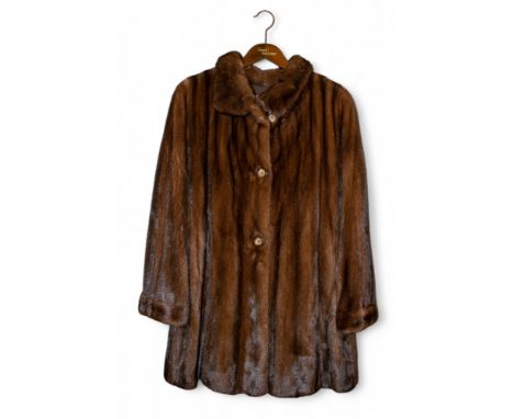 Continental Circa 1980 An elegant reversible three-quarter length mink fur coat The dark brown fur lined with a reversible in