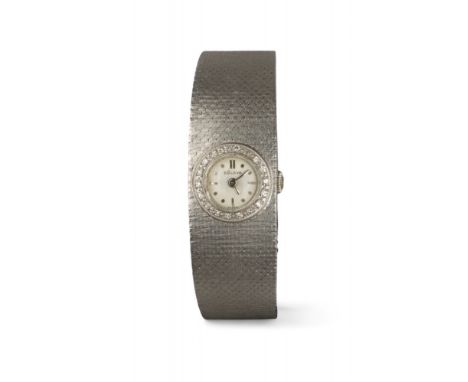 Bulova Swiss 1960s A 14 carat white gold and diamond ladies wristwatch. The circular dial signed 'Bulova'. With a circular di