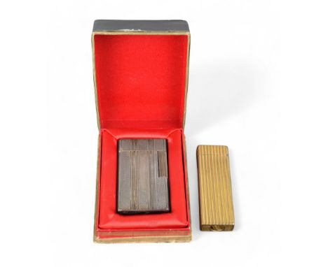 20 Century Two lighters, one a Dunhill gold coloured one, the other an S.T. Dupont silver coloured lighter with original warr