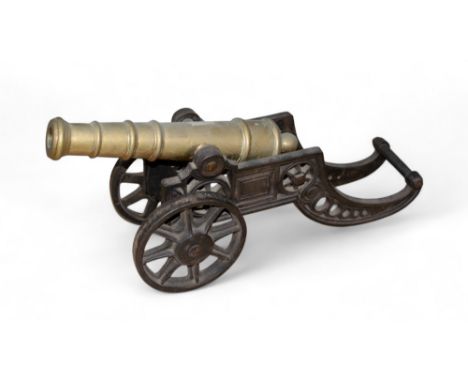 A fine iron and brass model cannon  Property of a gentleman From the Peter Roe collection  To be sold without reserve  Dimens