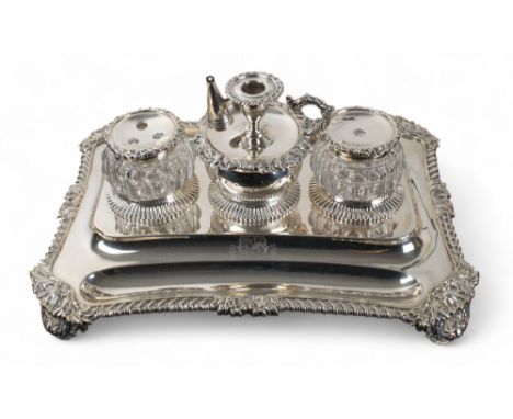 George IV A silver inkstand on shell bracket feet with two silver-mounted glass jars and a central silver well Marked Rebecca