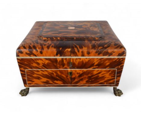 Continental 19th Century A two-drawer tortoiseshell sewing casket, with an iridescent mother of pearl focal point, brass paw 