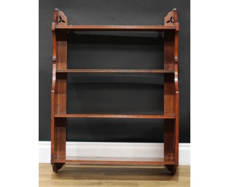 An Arts &amp; Crafts mahogany wall-hanging open bookcase or wall shelf, shaped end supports, 86.5cm high, 64cm wide, 20.5cm d