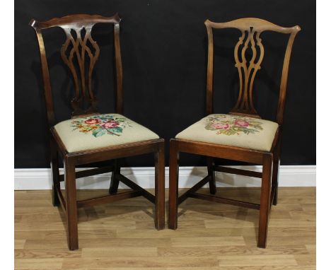 An associated pair of George III style Chippendale design dining side chairs, one stamped 4156 239, drop-in needlepoint seats