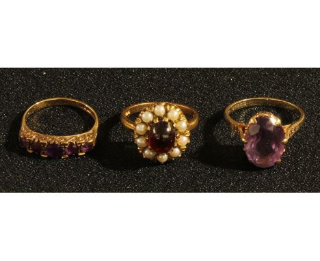 A 9ct rose gold single stone amethyst ring, ring size Q, 3.7g; a 9ct rose gold five stone amethyst ring, ring size O, 2.6g; a