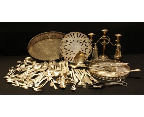 A set of Community Plate flatware; an EP ladle and other flatware; a table candelabra; an EPNS tray; another; sugar casters; 