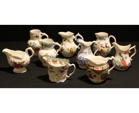 A collection of nine Royal Worcester cabinet jugs, decorated after 18th century Dr Wall pieces, various shapes and sizes, pri