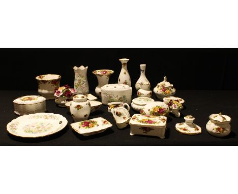 A Royal Albert Old Country Roses vase, miniature ginger jar and cover, jardiniere, wheelbarrow of flowers, candlestick, etc; 