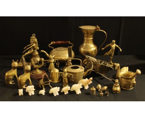 A brass car mascot as a female nude; other brassware, footballer, kettle, mortar and pestle, ship's wheel nut cracker, etc; a