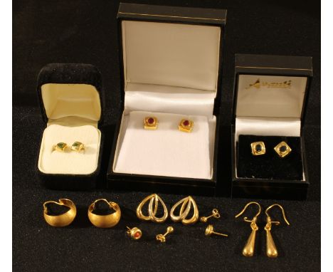 A pair of 18ct gold and ruby square stud earrings, seven other pairs of 18ct gold earrings, marked 750, 14.5g 