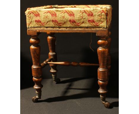 An oak footstool, woolwork tapestry upholstery, turned legs, ceramic casters, 45cm high, c.1900 