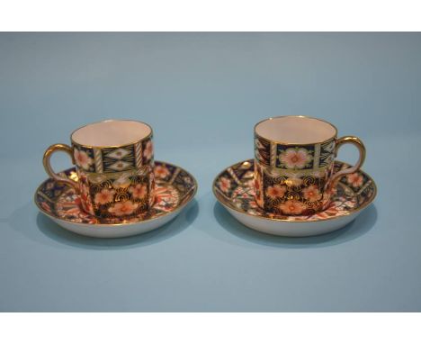 Two Royal Crown Derby coffee cans and saucers, numbered 2451