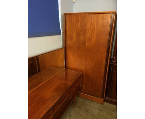 An Austin suite teak bedroom suite comprising chest of drawers, dressing table and wardrobe