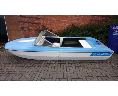 A Glastron 15 foot speed boat with a Johnson 35 sea horse engine