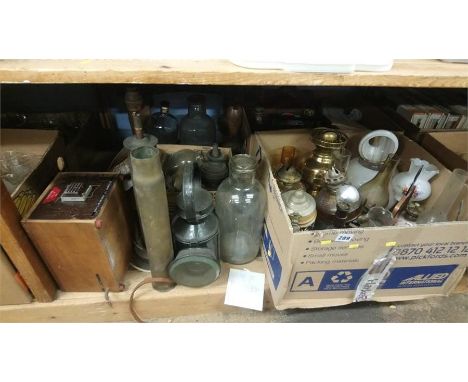 Shelf of assorted, Shell brass lamp and oil lamps etc.