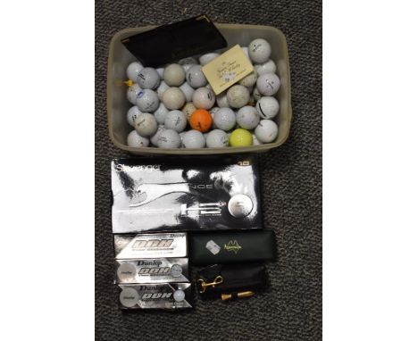 A selection of modern Golf balls and accessories including Dunlop and Slazenger