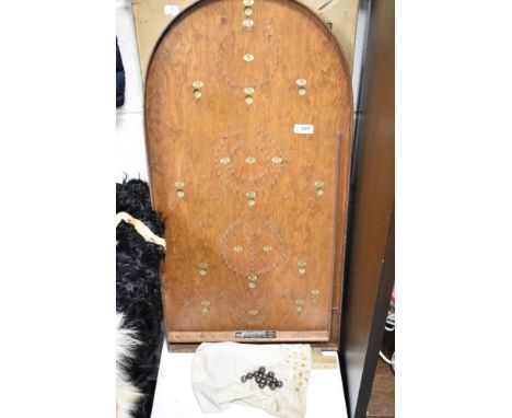A vintage Corinthian bagatelle board with ball bearings