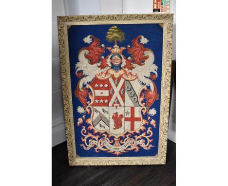 A vintage wool work embroidery of a heraldic crest with motto Will God and I Shall
approx 33" by 22" to inside of frame.